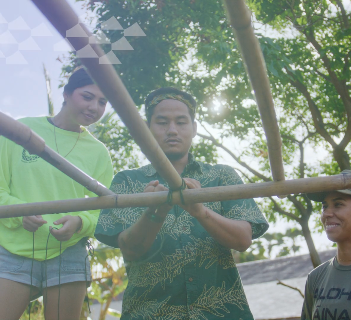 People building a bamboo structure in a still from Ryan Kawamoto's work